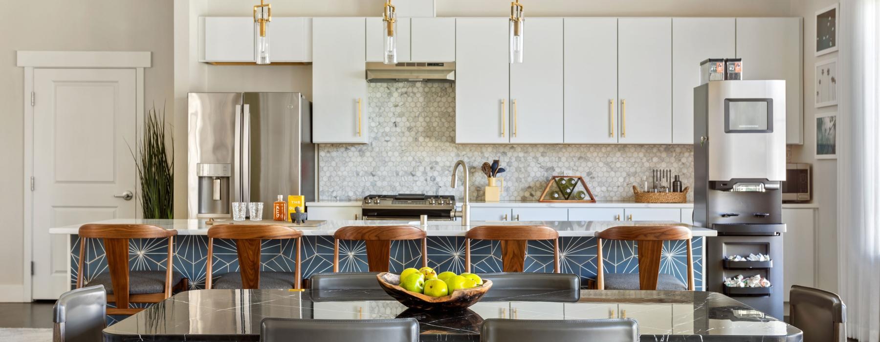 a kitchen with a dining table and chairs