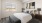 a bedroom with a bed and a lamp