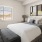a bedroom with a bed and a lamp