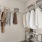 a room with a rack of clothes